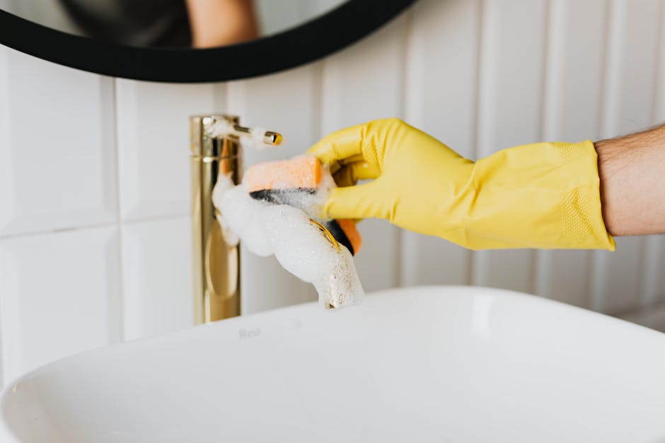 Detailed cleaning of bathroom sink for move-out cleaning